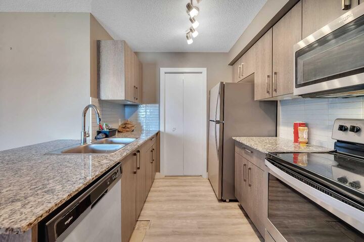 Property Photo:  4641 128 Avenue NE 4206  AB T3N 1T5