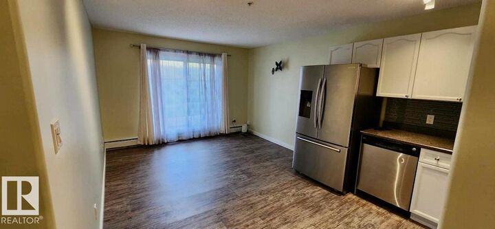 Property Photo:  70 Woodsmere 110  AB T8L 4R8 