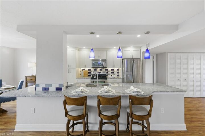 Property Photo:  11 Bluebill Ave 201  FL 34108 