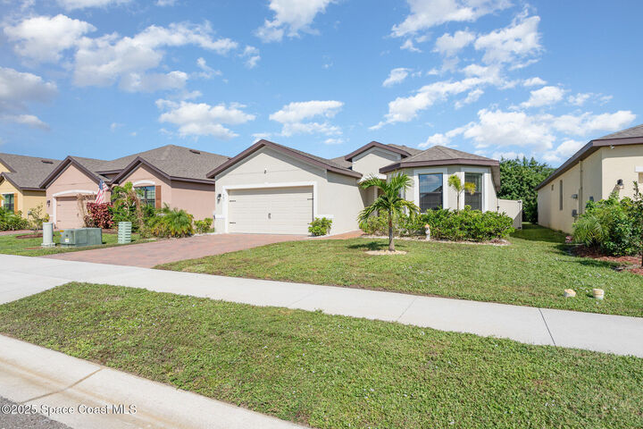 Property Photo: 943 Remington Green Drive SE FL 32909