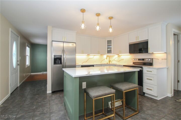 Property Photo: 8183 Venice Heights Drive NE OH 44484