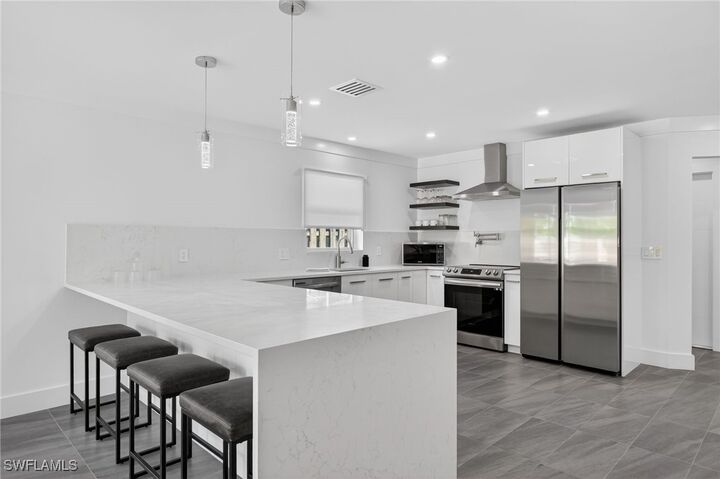 Property Photo:  565 110th Avenue N  FL 34108 