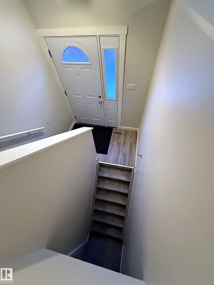 Property Photo:  8908 144 Avenue NW D  AB T5E 5V4 