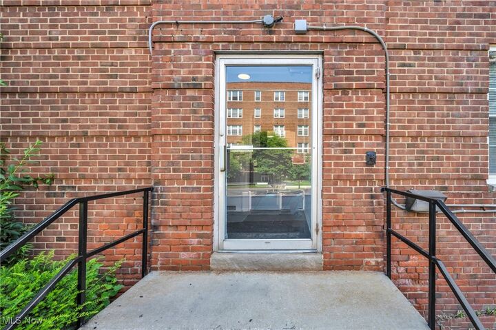 Property Photo:  13800 Fairhill Road 520  OH 44120 