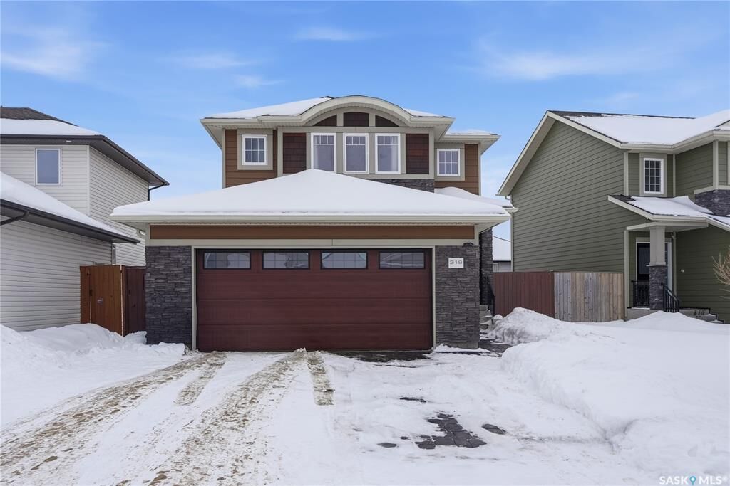 Property Photo:  319 East Hampton Boulevard  SK S7R 0A5 