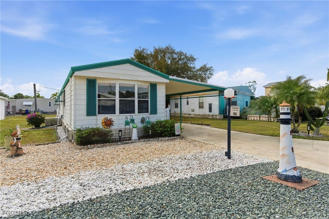 Property Photo: 9838 Sugarberry Way FL 33905