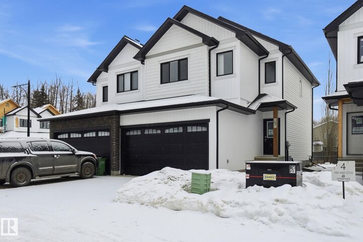 Property Photo:  5122 213A Street NW 5  AB T6M 1M6 