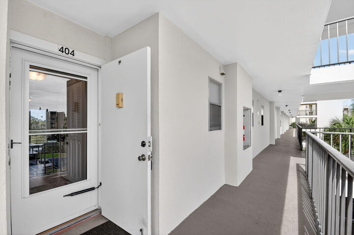 Property Photo:  3871 Via Poinciana 404  FL 33467 