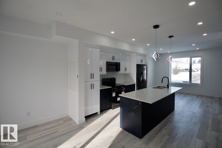 Property Photo:  12224 126 Street NW Main  AB T5L 0W8 