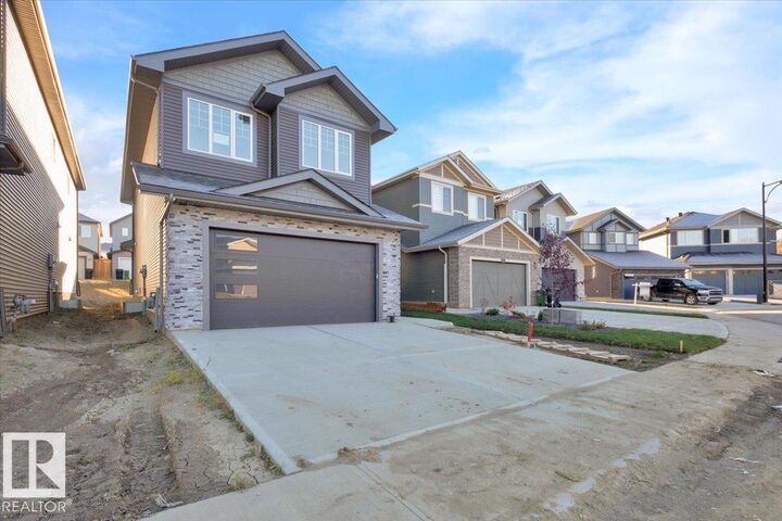 Property Photo:  1115 Gyrfalcon Crescent NW  AB T5S 0S1 
