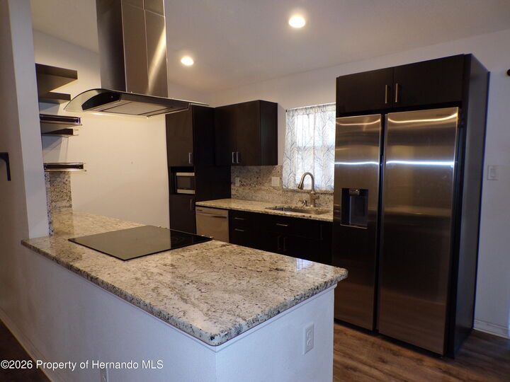 Property Photo:  10001 Elgin Boulevard  FL 34608 