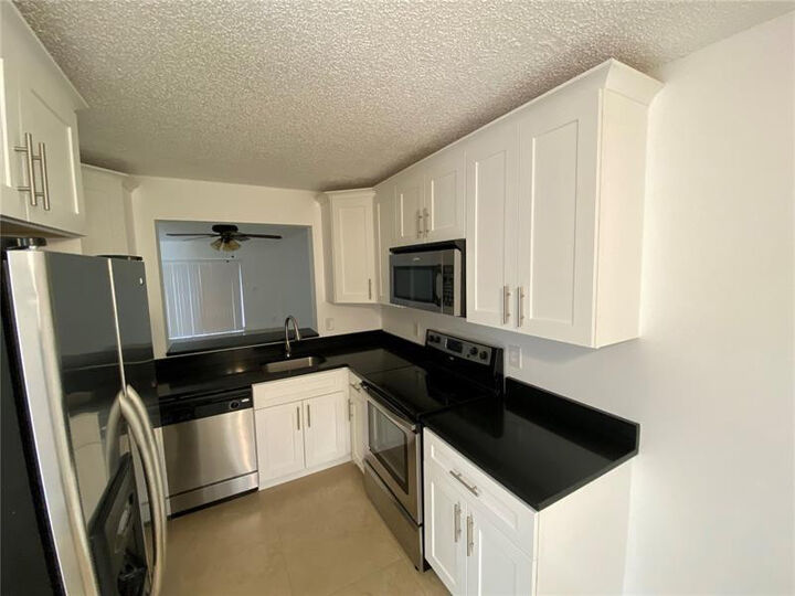 Property Photo:  23466 SW 57th Avenue 504  FL 33428 