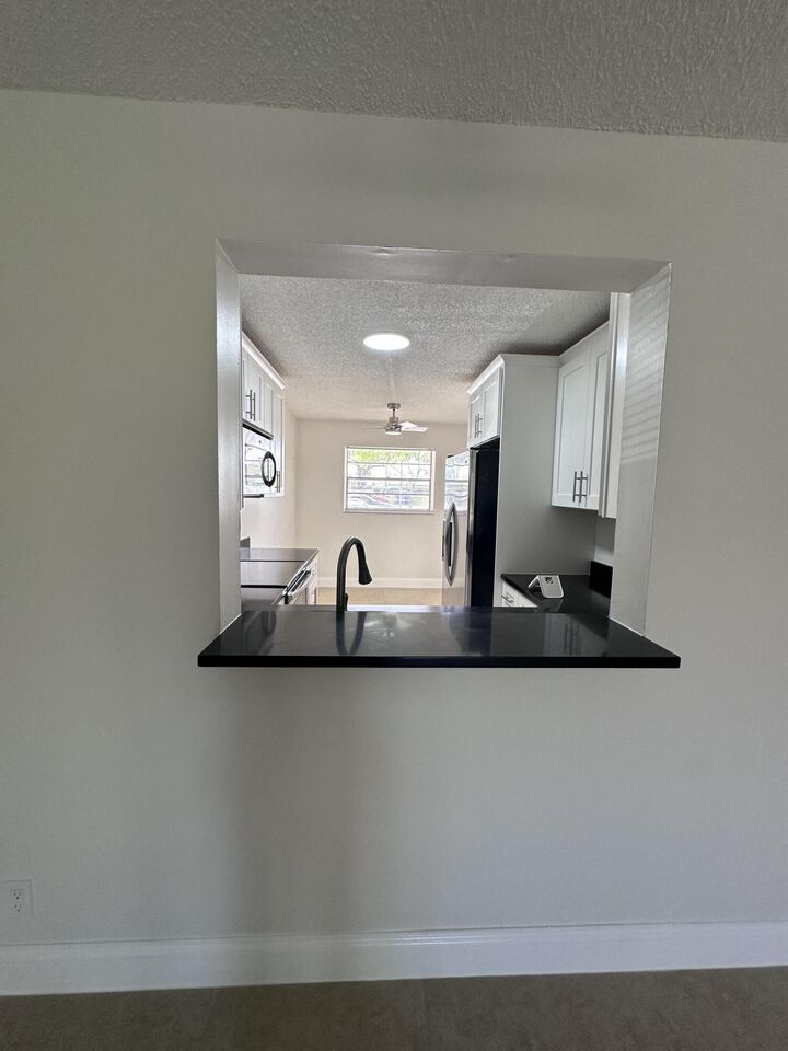Property Photo:  23466 SW 57th Avenue 504  FL 33428 