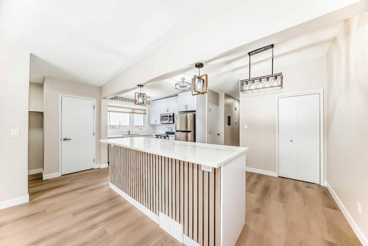 Property Photo:  7406-7408 Hunterfield Road NW  AB T2K 4L1 