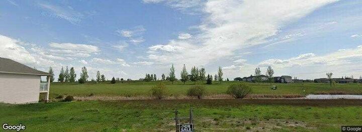 Property Photo: 617 Whispering Greens Avenue AB T0L 2B0
