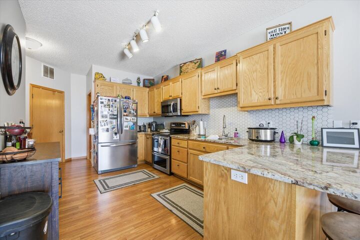Property Photo:  16812 Embers Avenue 2002  MN 55024 