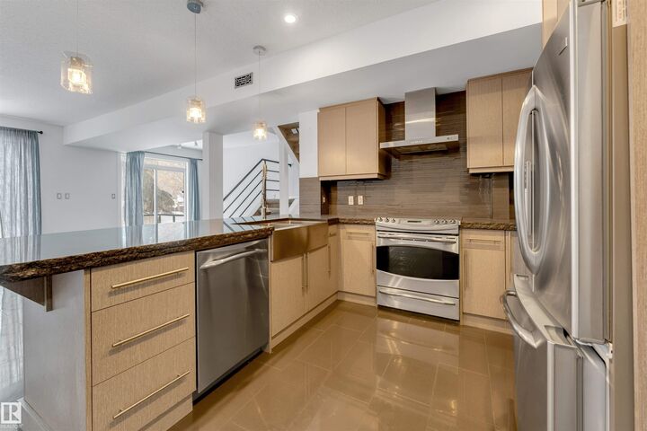 Property Photo:  10711 83 Avenue NW 102  AB T6E 2E5 