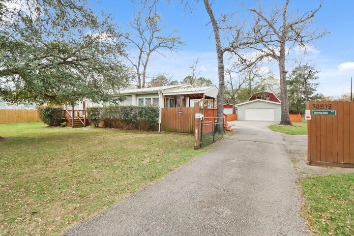 Property Photo:  30935 Towering Oaks Drive  TX 77355 