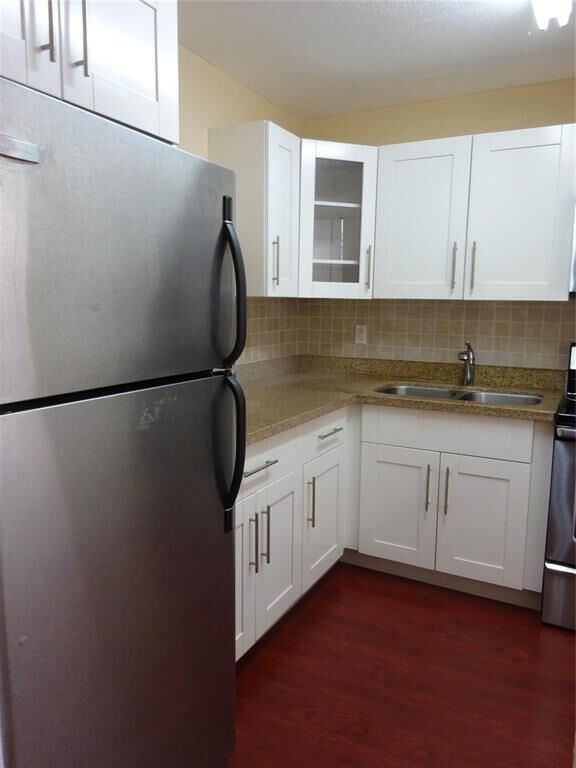 Property Photo:  6050 NW 64th Avenue 307  FL 33319 