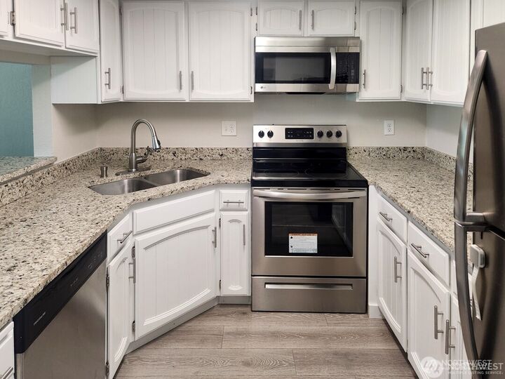 Property Photo:  2611 NE 4th 234  WA 98056 