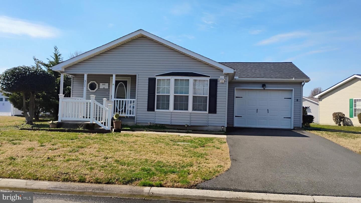 Property Photo:  311 W Persimmon Circle W 311  DE 19901 