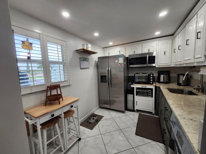 Property Photo:  2300 NE 1st Lane 309  FL 33435 