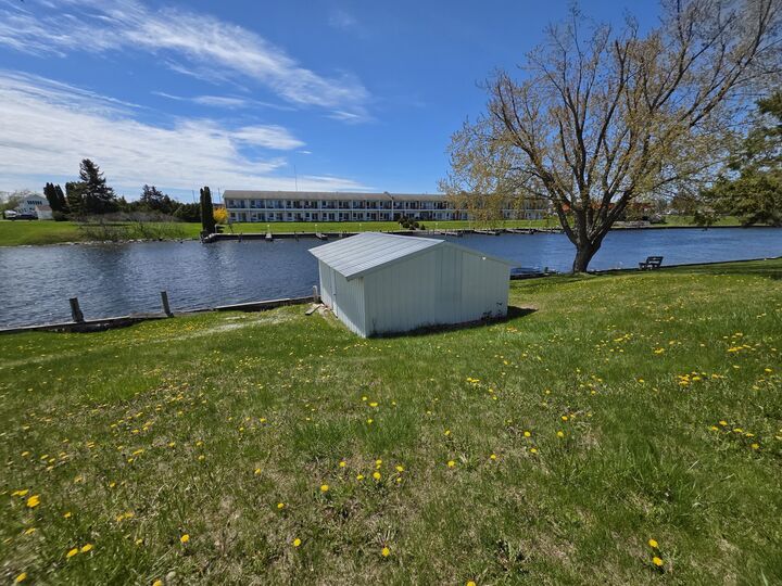 Property Photo:  216 Riverside Drive  MI 49721 