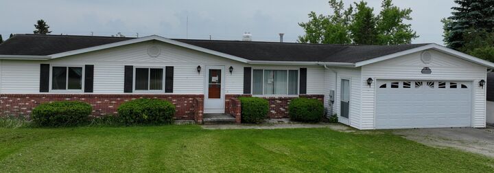 Property Photo:  216 Riverside Drive  MI 49721 