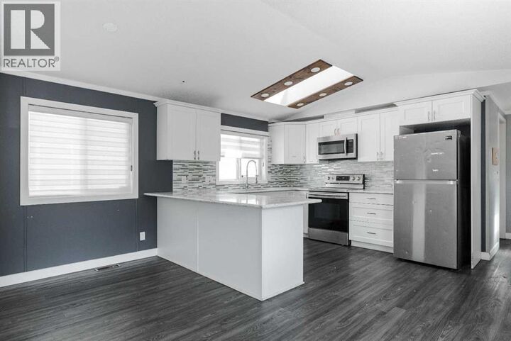 Property Photo: 216 Harpe Way AB T9K 2K8