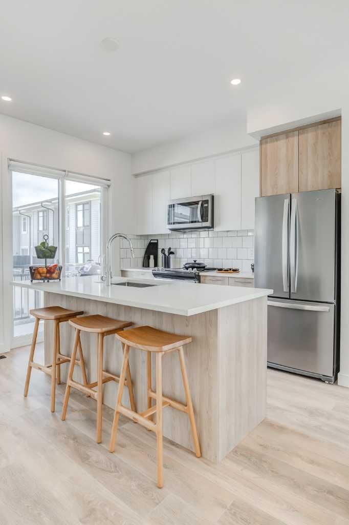 Property Photo: 857 Belmont Drive SW 213 AB T2X 4P2