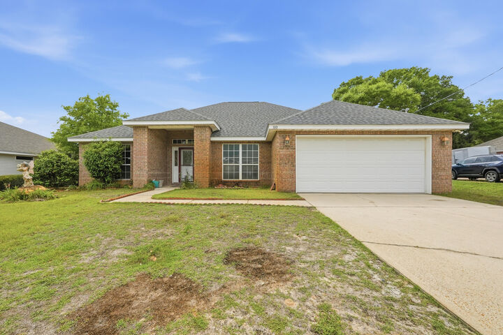 Property Photo:  100 Marimba Street  FL 32569 