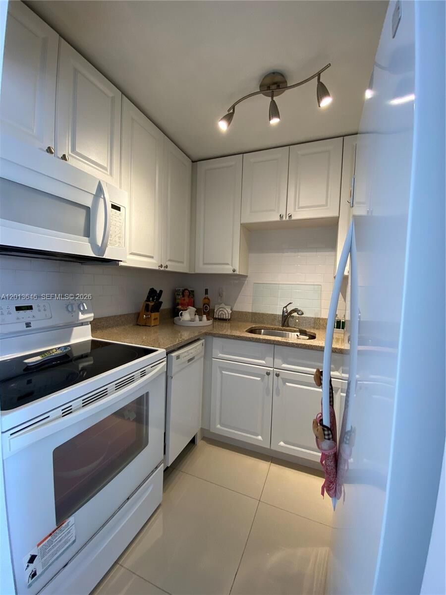 Property Photo:  5050 NW 7th St 312  FL 33126 