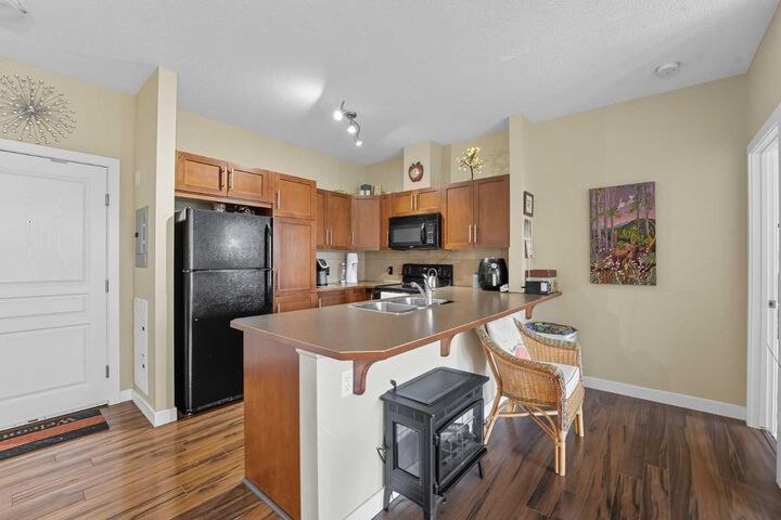 Property Photo:  48 Panatella Road NW 310  AB T3K 0V4 