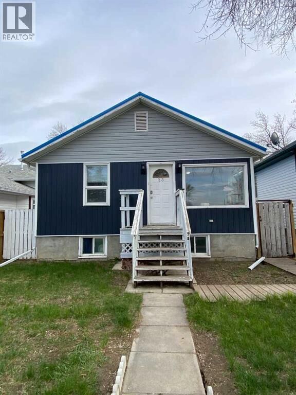 Property Photo:  23 Pine Avenue West  AB T1A 0A1 