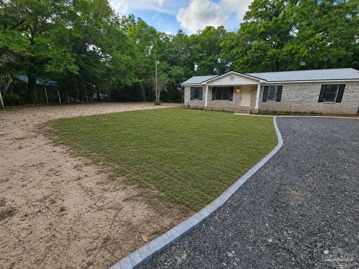 Property Photo:  10598 Kansas Ave  FL 32583 