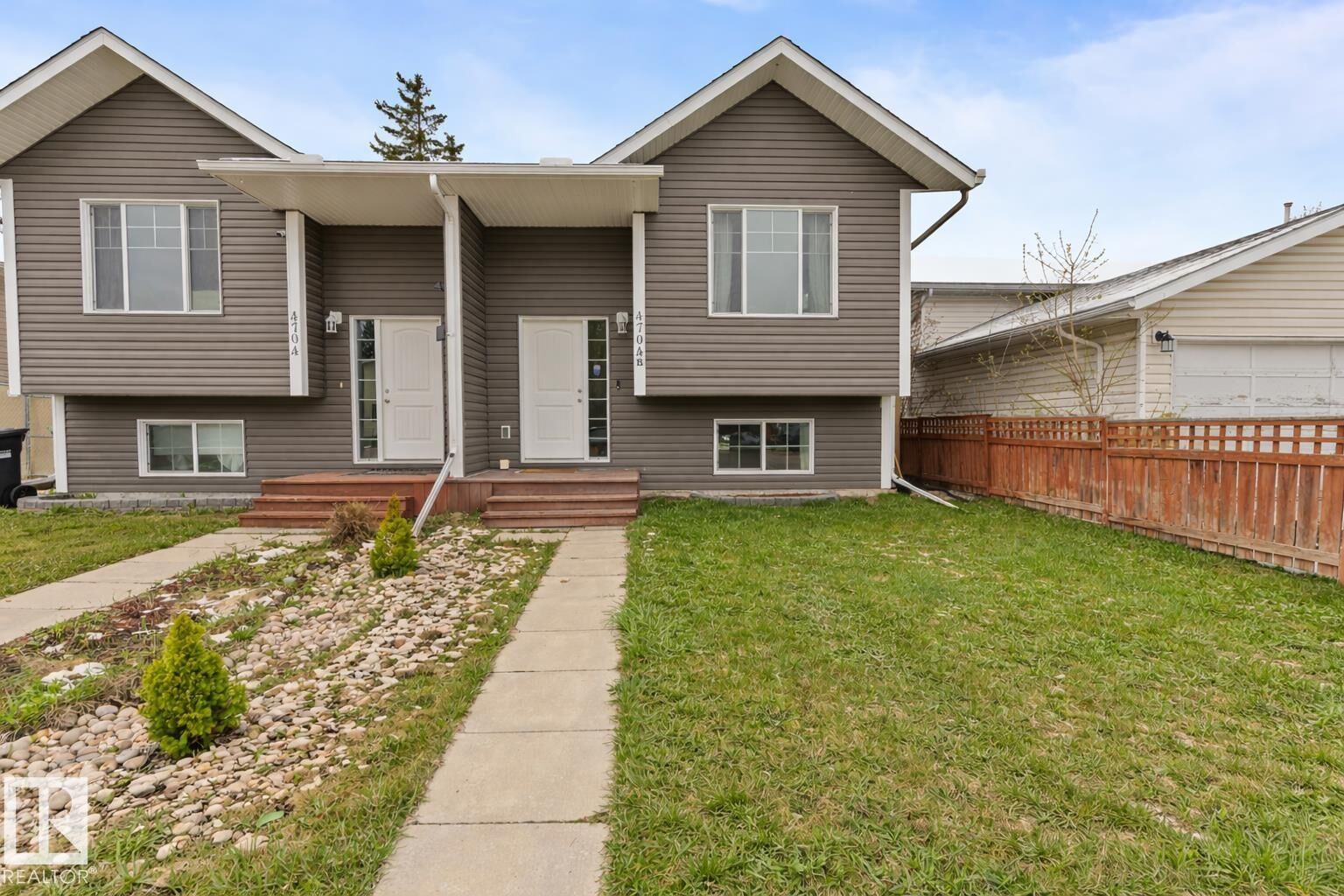 Property Photo:  4704B 48 Street  AB T9M 1Y4 