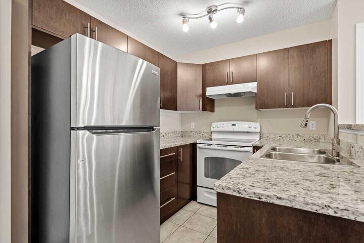 Property Photo:  8 Bridlecrest Drive SW 1203  AB T2Y 0H6 