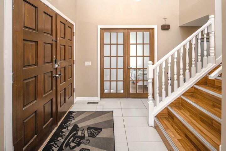 Property Photo: 180 Woodglen Way SW AB T2W 4T3