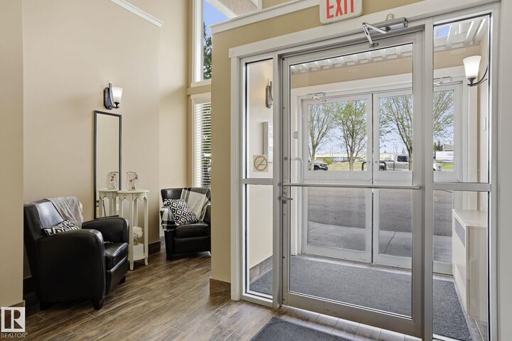 Property Photo:  4922 52 Street 208  AB T0G 1N0 