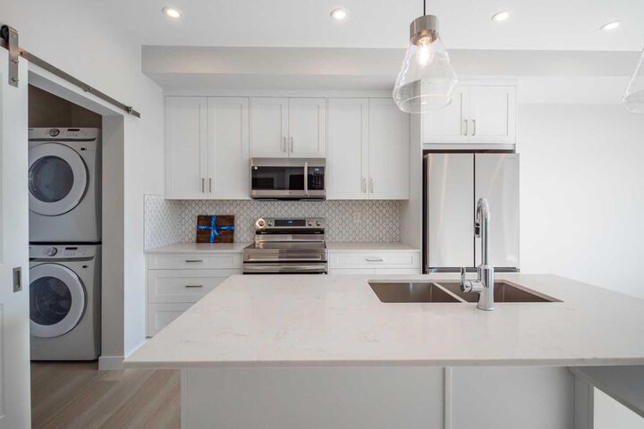 Property Photo: 1802 Mahogany Boulevard SE 7202 AB T3M 4J2