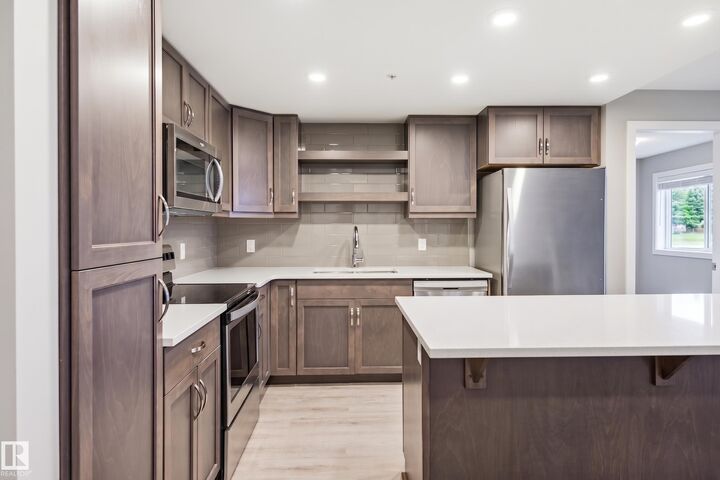 Property Photo:  5504 Schonsee Drive NW 232  AB T5Z 0N9 