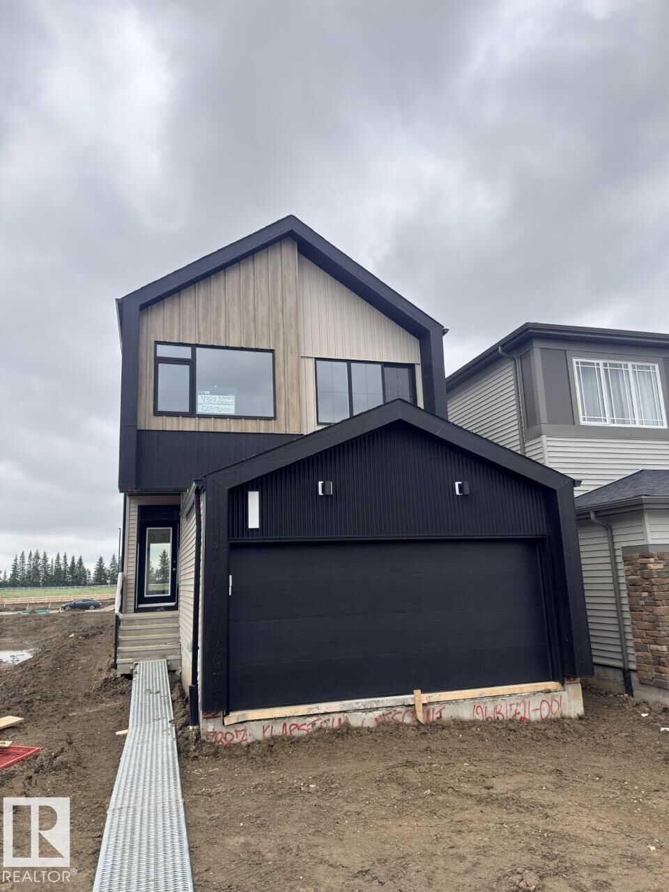 Property Photo: 7387 Klapstein Crescent SW AB T6W 0A6