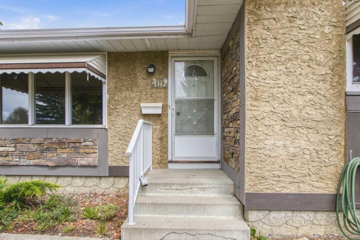 Property Photo:  4112 - 13 Avenue NE  AB T2A 0K8 