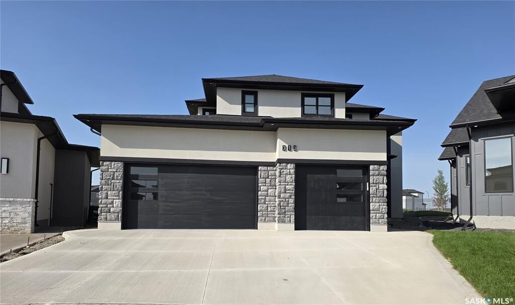 Property Photo: 319 Woolf Bay SK S7W 1E5