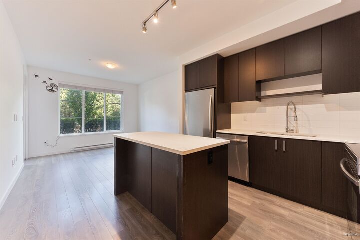 Property Photo: 13623 81A Avenue 103 BC V3W 3N7