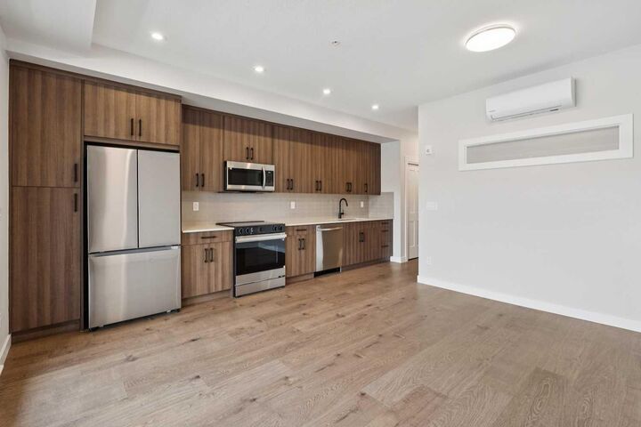 Property Photo: 1802 Mahogany Boulevard SE 7107 AB T3M 4A5