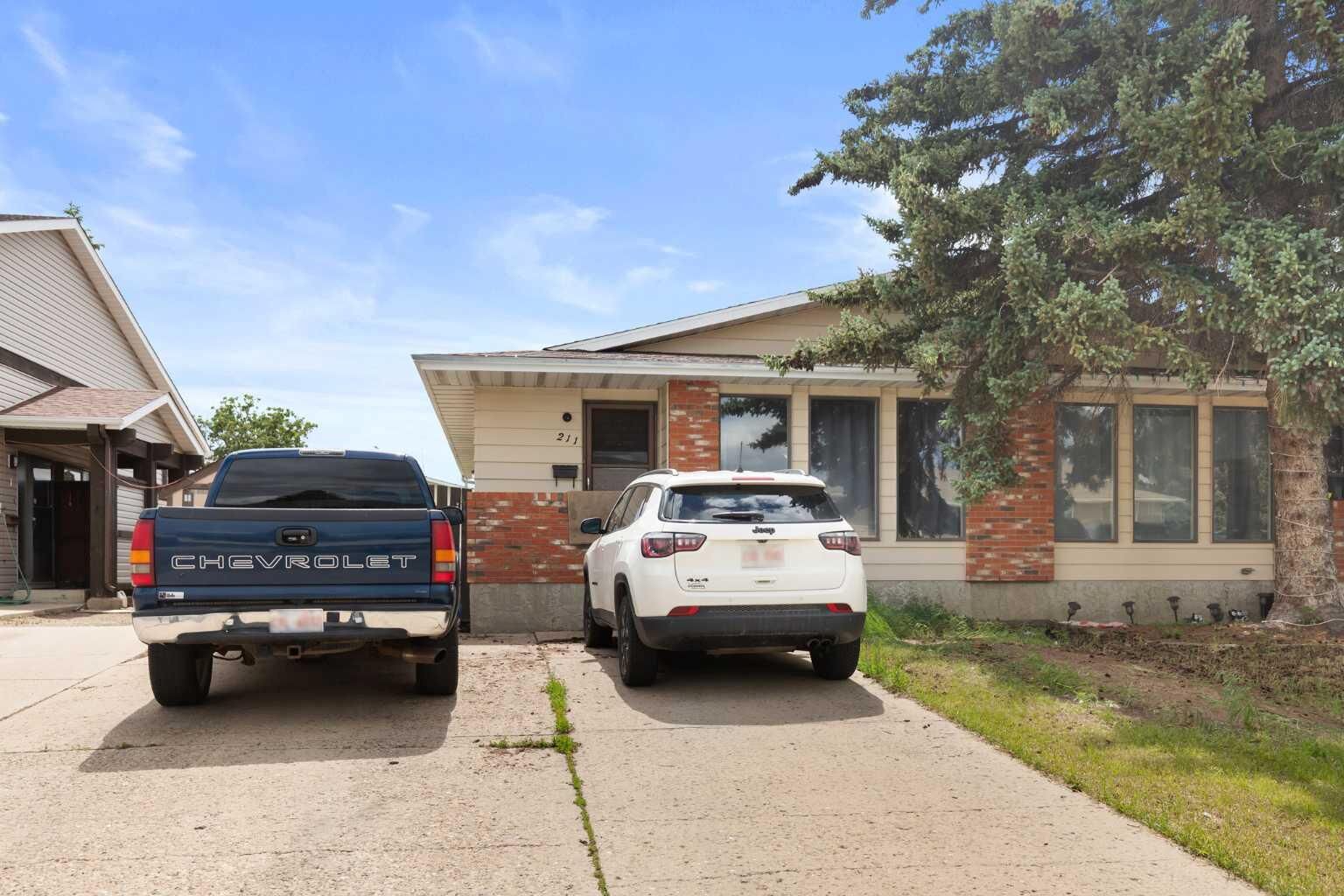 Property Photo: 211 Ross Glen Drive SE AB T1B 1N7