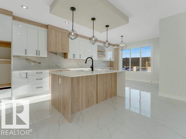 Property Photo:  7023 177 Avenue NW  AB T5Z 0W9 