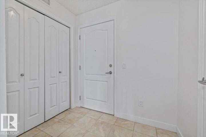 Property Photo:  12650 142 Avenue NW 114  AB T5X 0J5 