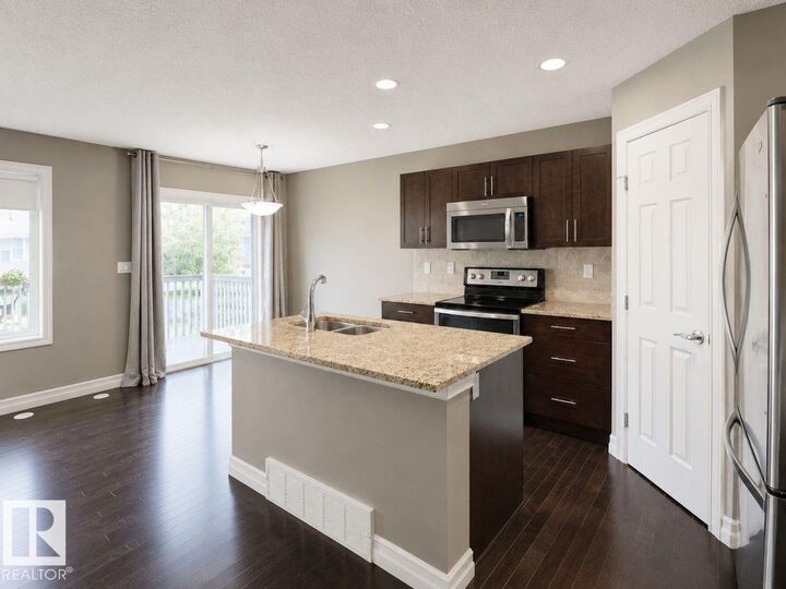 Property Photo:  219 Charlotte Way 66  AB T8H 0T3 
